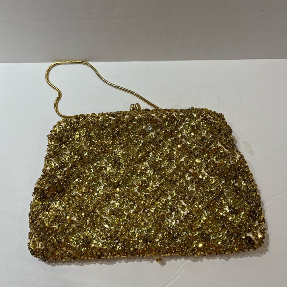 Vintage hand beaded purse with sequins & beads made in Hong Kong . Metal handle,